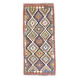 A vegetable dyed wool Choli Kelim rug, with diamond patterned field and geometric borders, 143 by