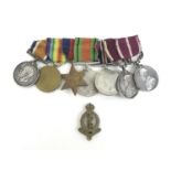 A group of WWI and WWII medals, bearing the name '2210 A.S. Sgt. W. Fletcher RAMC (Royal Army