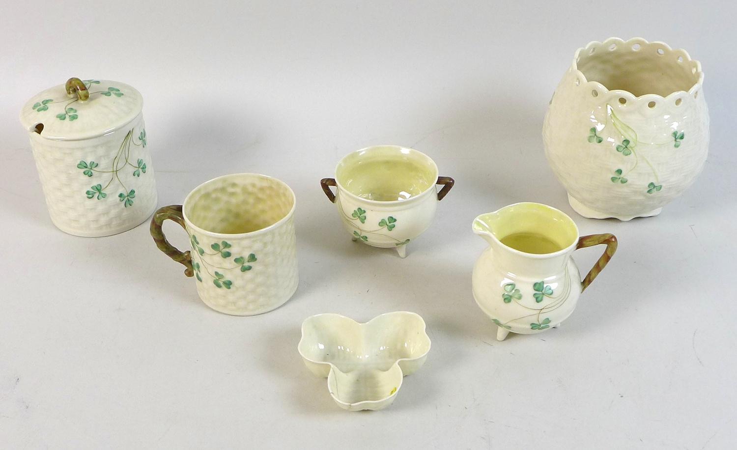 A small collection of Belleek china, shamrock pattern, comprising a basket weave moulded vase, 12 by