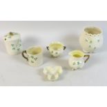 A small collection of Belleek china, shamrock pattern, comprising a basket weave moulded vase, 12 by