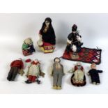 A group of early 20th century dolls, comprising a French fisherman and fisherwoman each holding a