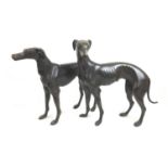 A pair of 20th century cast bronze life size sculptures of whippets, of a bitch and a dog, unsigned,