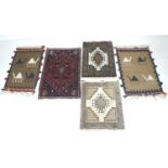 A group of five prayer rugs, comprising three Iranian wool, and two flat weave with camel motifs.