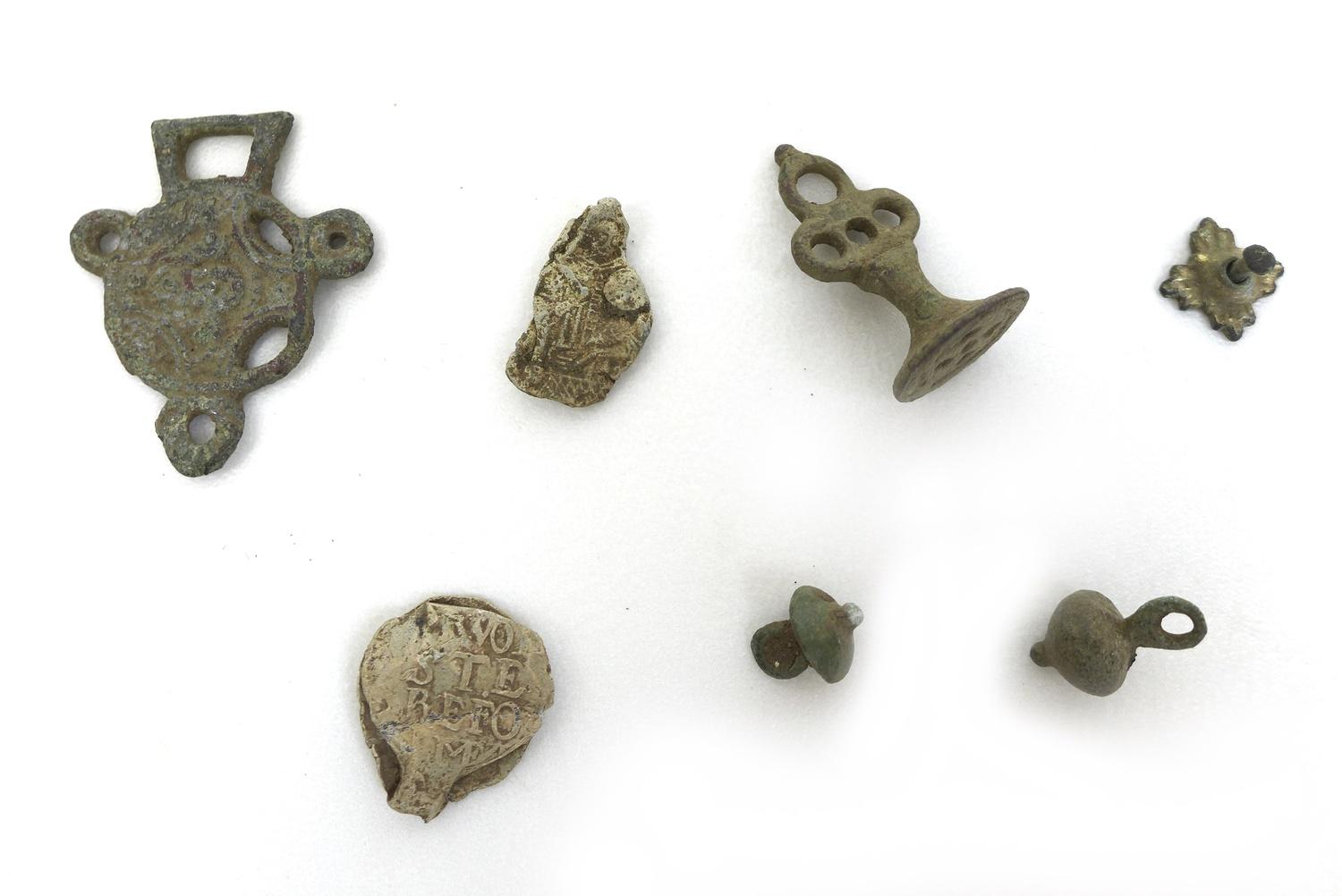 A collection of seven detectorist finds dating from 13th century and later, a 17th century cloth