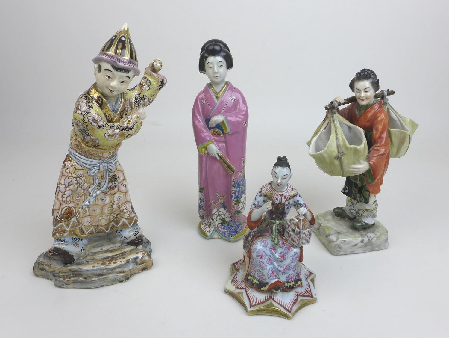 A group of four Oriental figurines, a Hochst style Chinese lady carrying her wares, with cartwheel