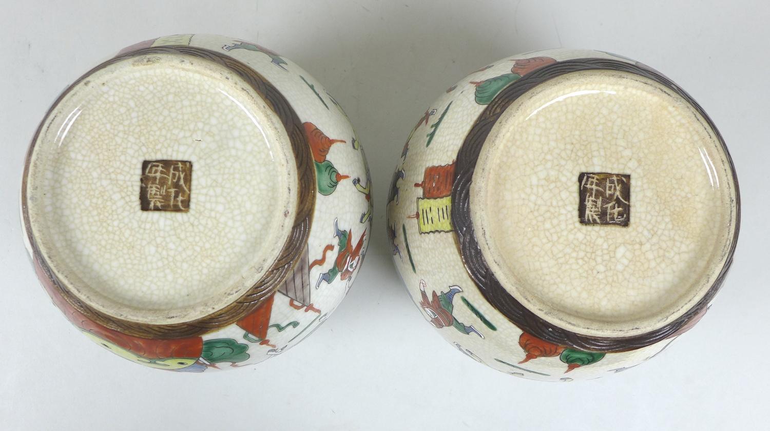 A pair of early 20th century Chinese porcelain ginger jars and covers, decorated as a mirrored pair, - Image 4 of 4