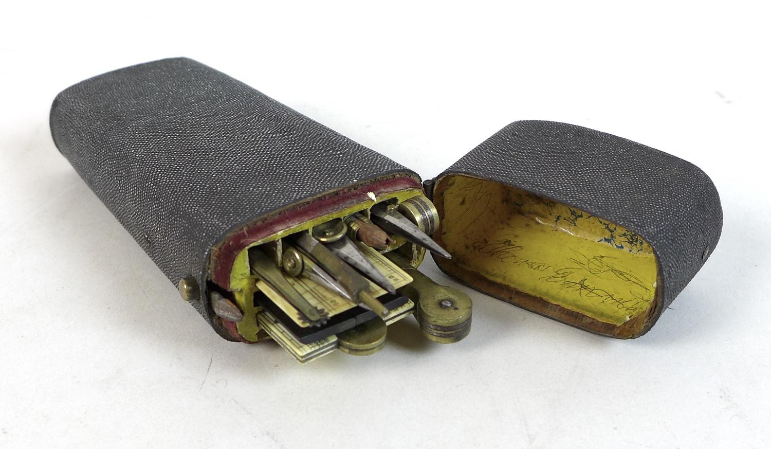 A George III shagreen drawing instrument case, the hinged lid opening to reveal a selection of