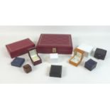 A collection of jewellery boxes, including two jewellery cases with gilt tooled red leatherette, a