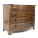 An early Victorian figured mahogany serpentine fronted chest of four graduating drawers, the