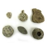 A collection of six detectorist finds, comprising two lead medieval seal matrixes, 3 by 0.6cm by 3.7