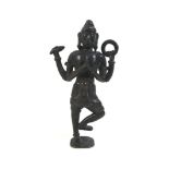 A cast bronze figure, of an Indonesian deity standing with palms together, two further arms with