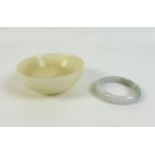 A Chinese mutton fat jade bowl, 11 by 4.5cm, together with a pale green and white jade bangle, 6cm