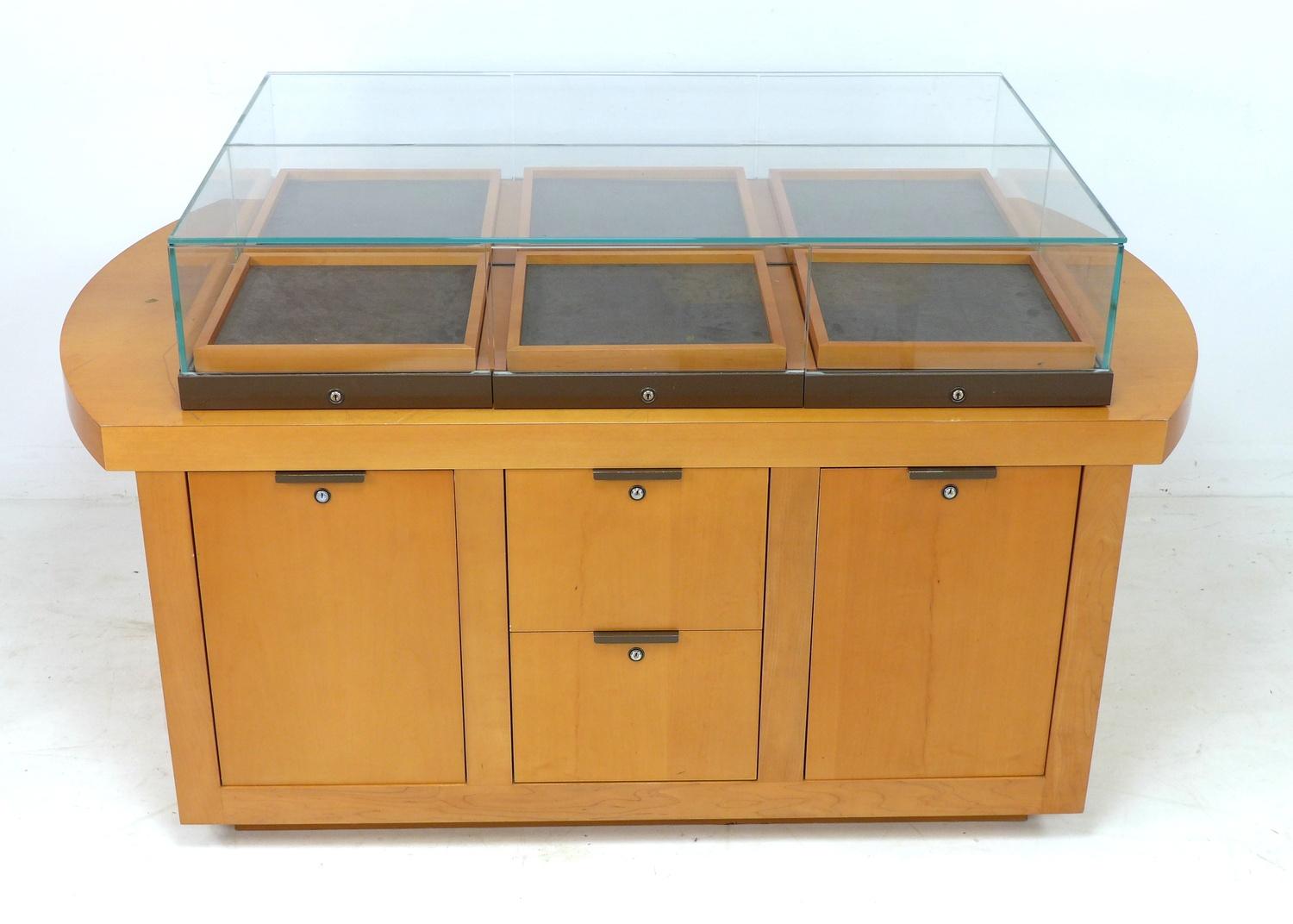 A modern shop display cabinet unit, with glazed box showcase to the surface comprising six