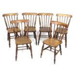 A set of six Victorian oak stick back Windsor dining chairs, with shaped seats and turned legs