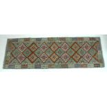 A vegetable dyed wool Choli Kelim runner, with diamond patterned field and geometric borders, 258 by