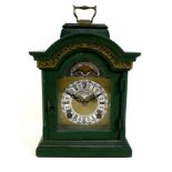 A vintage Dutch John Warmink mantel clock, with green painted case and brass carry handle, 8 day