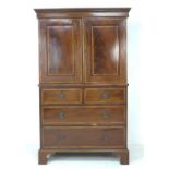 An Edwardian mahogany press cupboard, in George III style, with line inlay and crossbanded