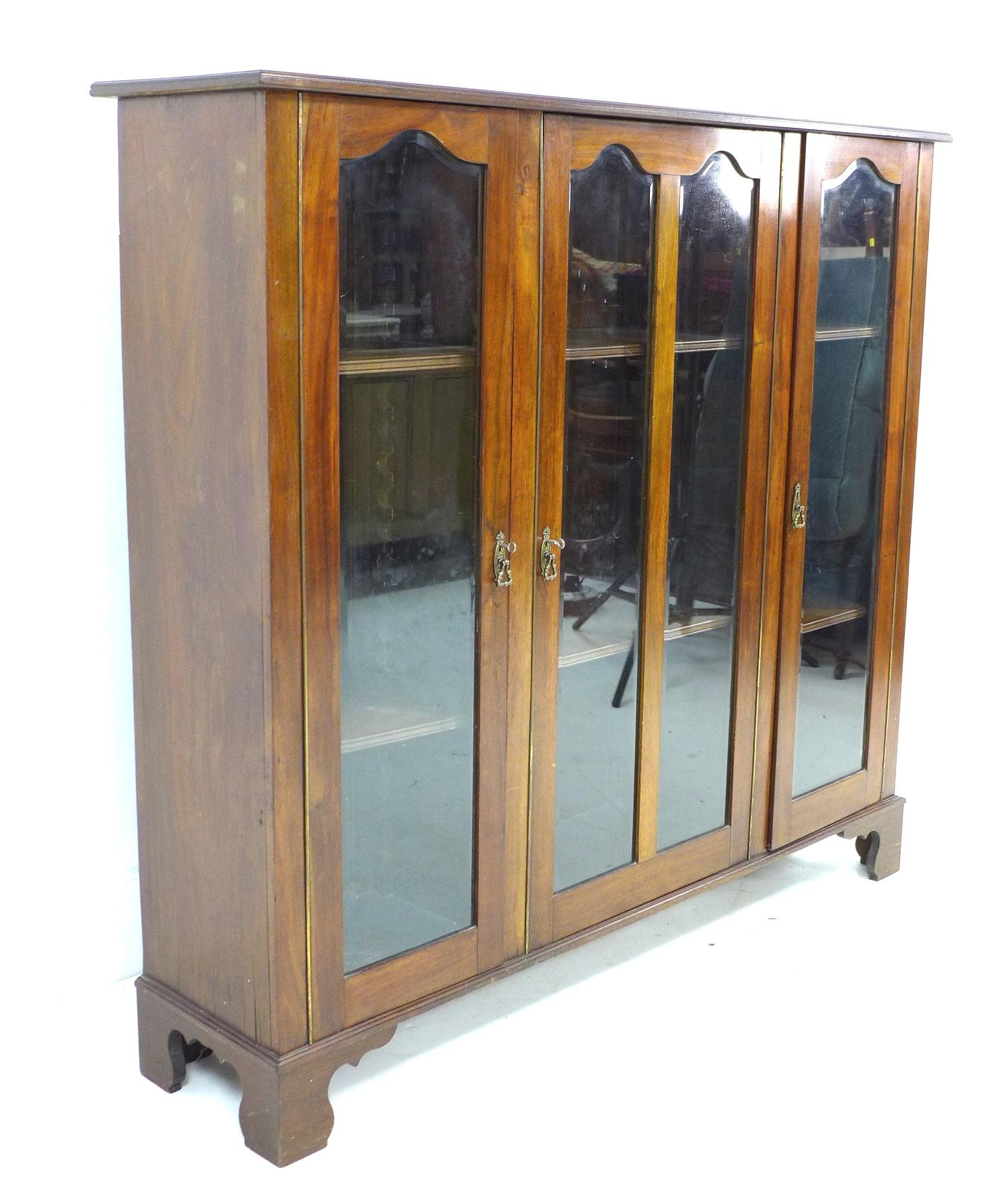 A mid 20th century mahogany glazed bookcase, with three glazed doors each enclosing two adjustable - Image 2 of 3
