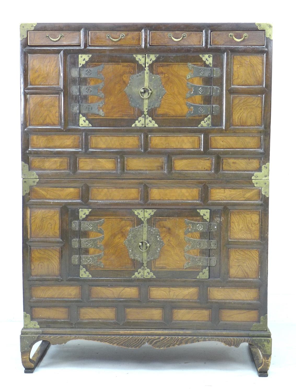 An early 20th century Chinese storage cabinet, of brick front design with brass corners and handles,