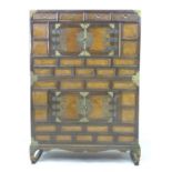 An early 20th century Chinese storage cabinet, of brick front design with brass corners and handles,