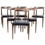 A set of six German teak dining chairs, circa 1970, of slender modern design, with black faux
