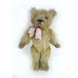 A circa 1930s Chad Valley blonde teddy bear, with 'Hygenic Toys Chad Valley' label to underside of