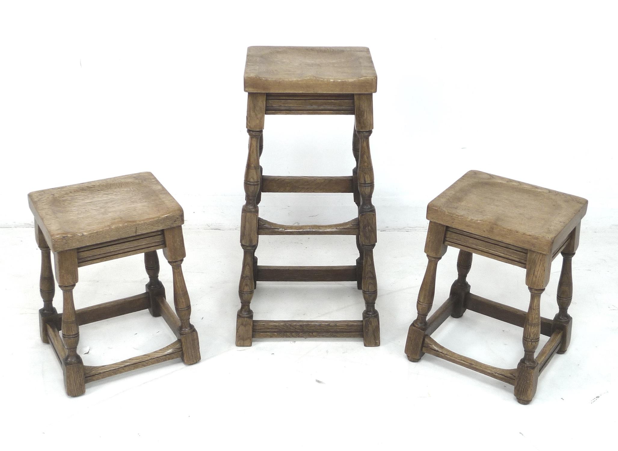 Three 1920s oak stools, comprising a pair, 35 by 40.5 by 77cm high, and taller single stool, 31 by - Image 2 of 2