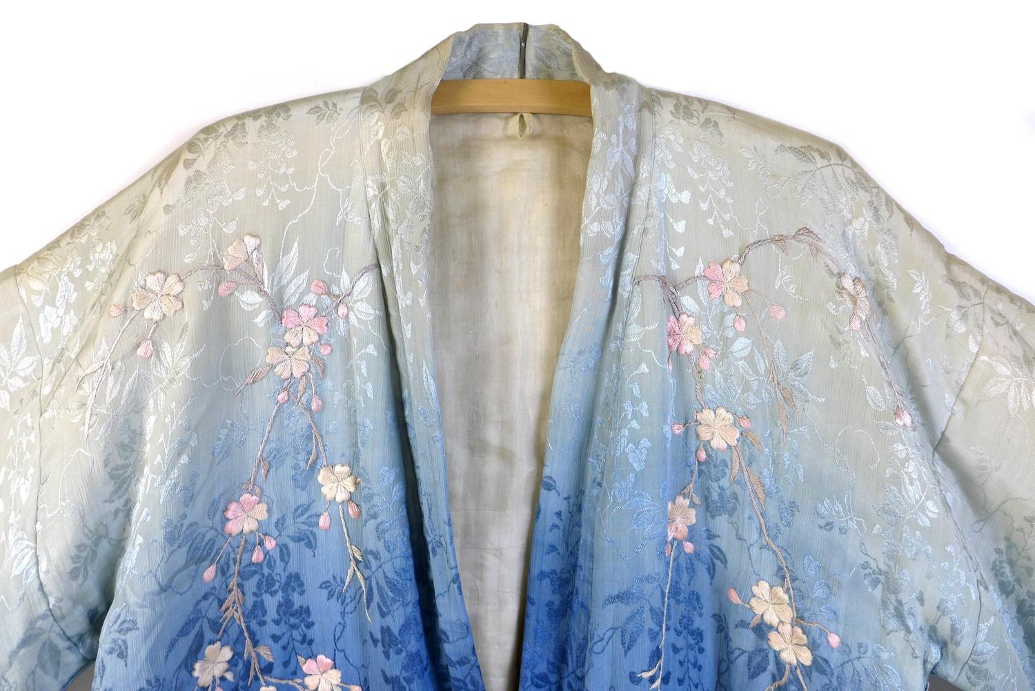 An early 20th century Japanese haori padded jacket, embroidered in silk with white and pink flowered - Image 4 of 17