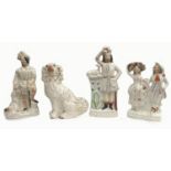A group of four Victorian flatback Staffordshire figurines, including one titled 'The Lion