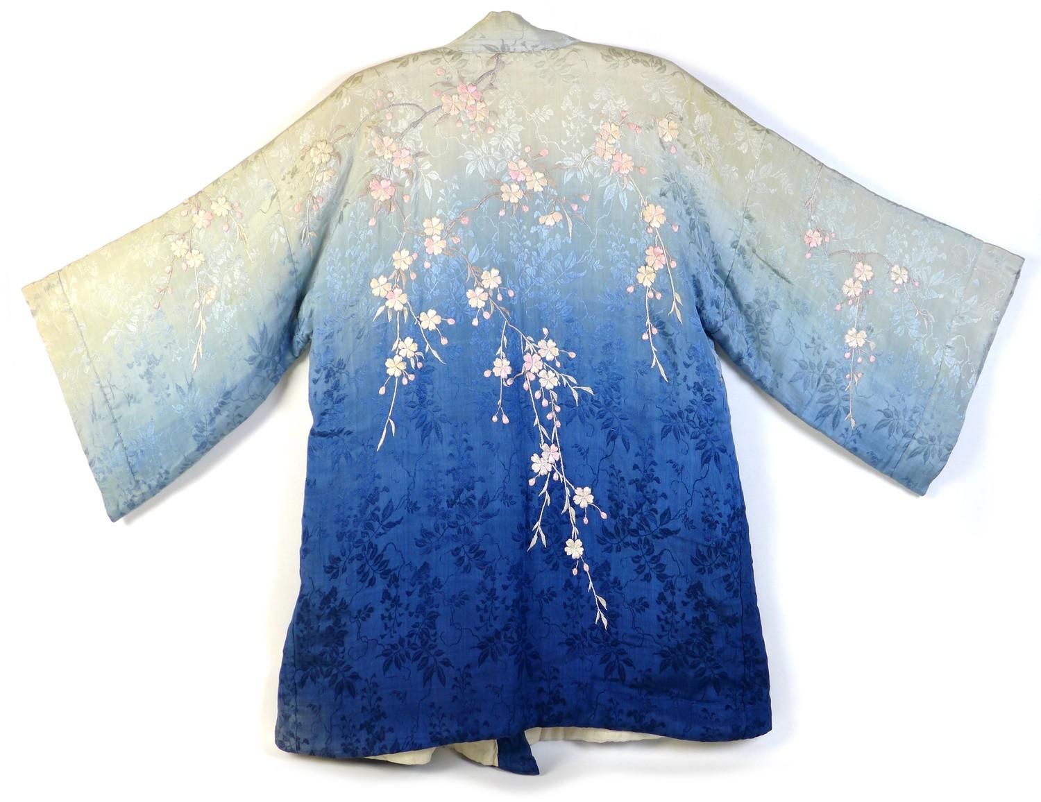 An early 20th century Japanese haori padded jacket, embroidered in silk with white and pink flowered - Image 2 of 17