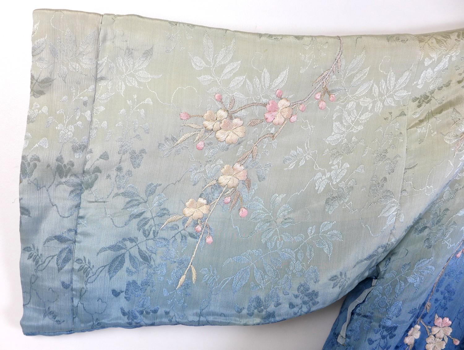 An early 20th century Japanese haori padded jacket, embroidered in silk with white and pink flowered - Image 7 of 17