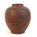 A Chinese Yixing pottery vase, incised decoration to one side with a dragon descending from the