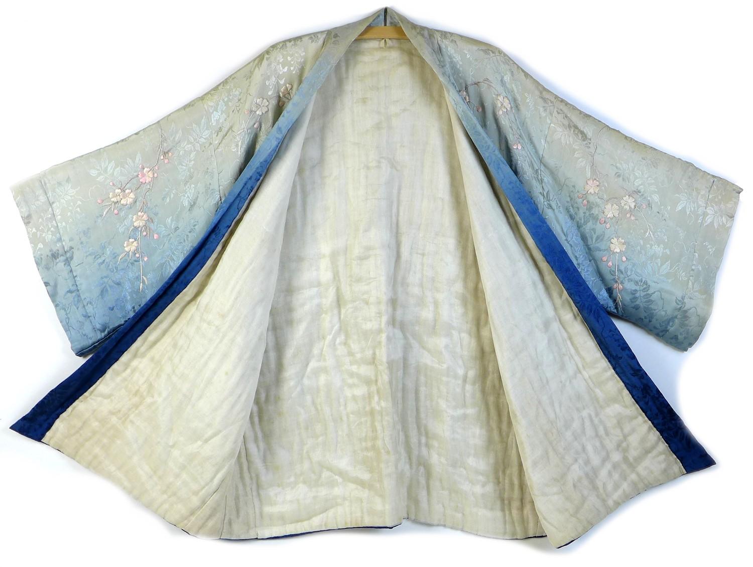 An early 20th century Japanese haori padded jacket, embroidered in silk with white and pink flowered - Image 3 of 17