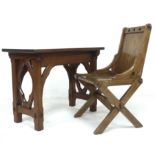 A mid 20th century pitch pine eclesiastical side table, 91.5 by 48.5 by 69cm high and chair, with