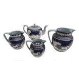 An early 19th century Copeland Spode teapot, together with with three matching graduating jugs,