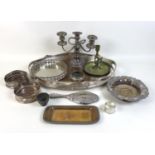 A group of silver plated items, including an oval twin handled tray with pierced gallery, 52 by 36