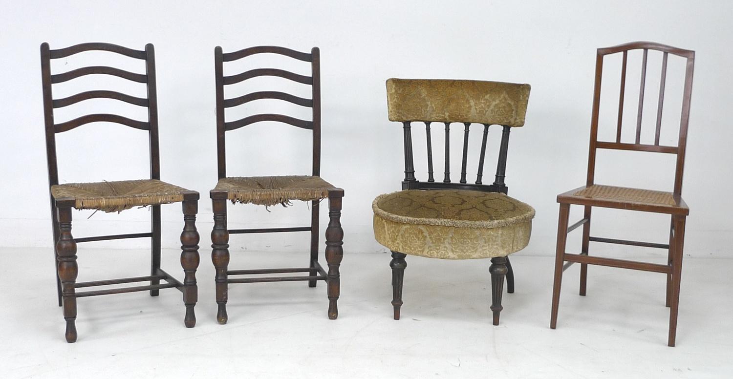 A Victorian ebonised bedroom chair, with fluted columns supporting a bowed rail, round seat