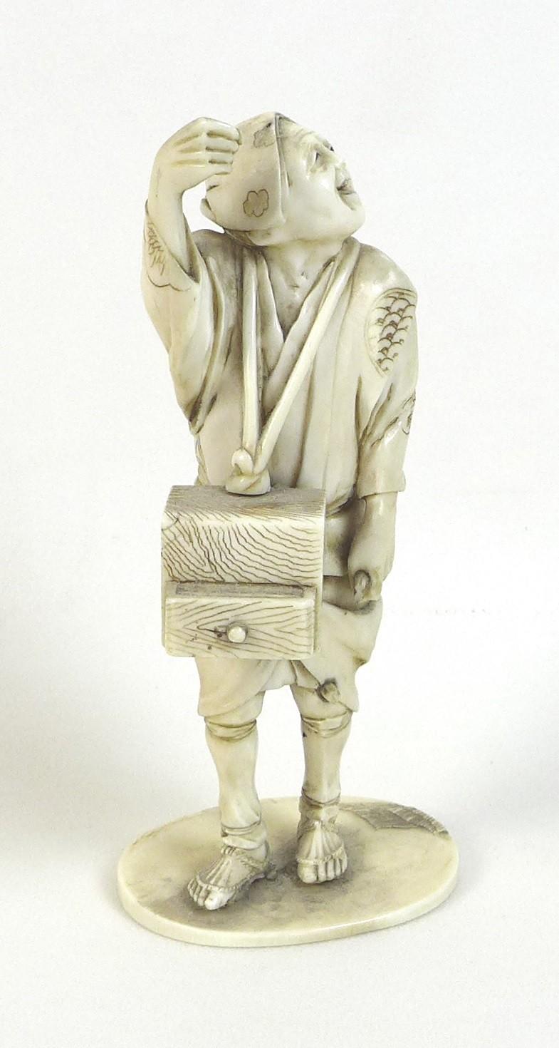 A Japanese ivory okimono, Meiji Period, late 19th century, modelled as a man standing looking up - Image 2 of 6