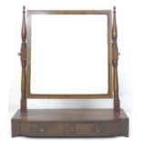 A late Georgian mahogany toilet mirror, with single drawer to bow fronted base, 61.5 by 23.5 by 71cm