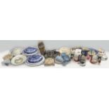 A large collection of mixed ceramics, including blue and white tureens, Royal commemorative cups and