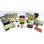 A group of military die-cast model toys, including a Dinky Military Ambulance (626), a Britains