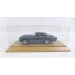 A limited edition Danbury Mint 1:24 scale 1964 Aston Martin DB5, in dark blue, numbered 3020/5000,