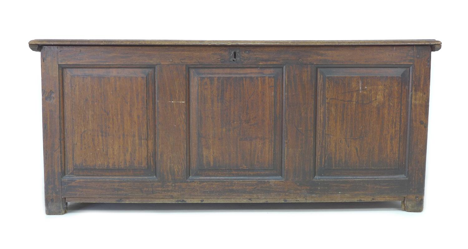 A large 18th century oak chest, two plank lift top, three panel front, stile feet, 155 by 63 by 67. - Image 2 of 8