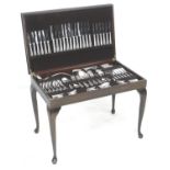 A suite of Osborne silver plated cutlery, in a modern mahogany canteen on stand, bead pattern,