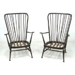 A pair of Ercol dark stained armchairs, 'Tall Back Easy Chair', model 478, in Old Colonial Antique