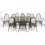 A set of eight Ercol dark stained stick back dining chairs, 'Quaker Windsor Chair', model 365, 49 by