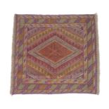 A Gazak rug, with orange, purple and light green diamond shaped decoration, latch hook edges, 117 by
