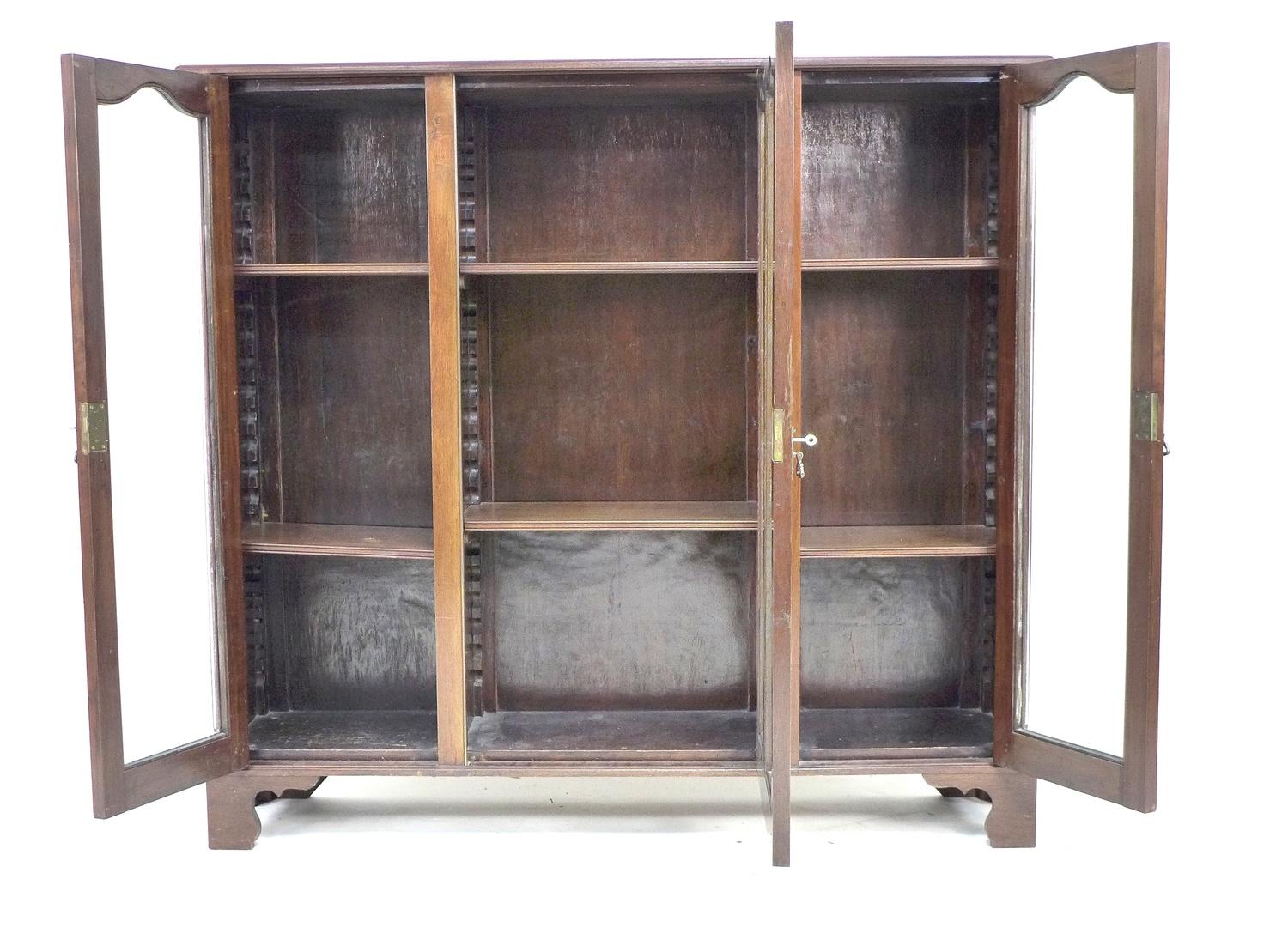 A mid 20th century mahogany glazed bookcase, with three glazed doors each enclosing two adjustable - Image 3 of 3