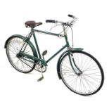 A vintage Elswick gents bicycle, painted green, with Sturmy Archer gears and dyno lights, Brooks