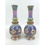 A pair of Meissen style baluster vases, both with profuse floral decoration, with Messen style marks